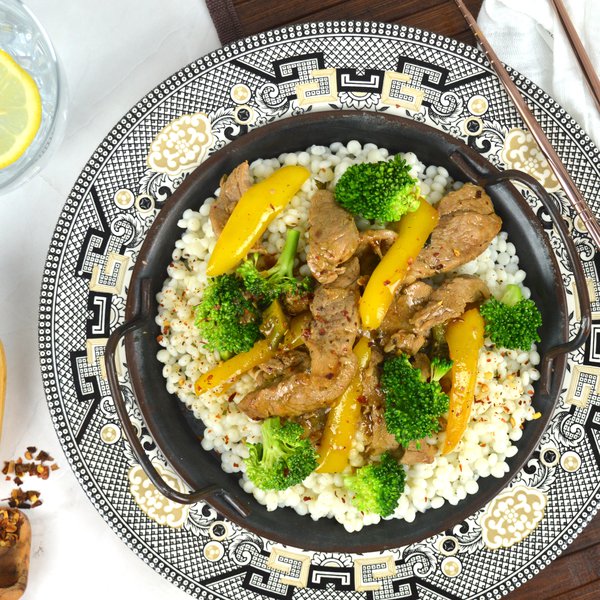 Szechuan pork tenderloin with pearl couscous and vegetables