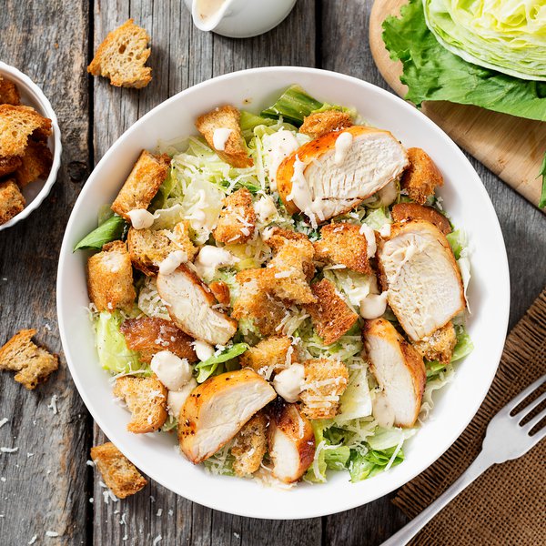 Chicken Caesar salad with croutons and bacon (BBQ)